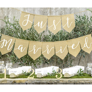 Neutral wedding burlap bunting with white print with the words just married printed  