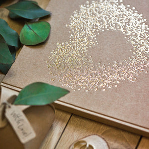 wedding guest book in gold foil and brown kraft paper