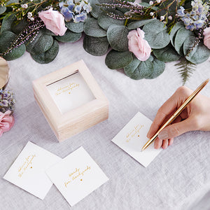 100 White wedding advice cards with the words printed 'words for newlyweds' in gold foil. Comes in a natural wooden box with a clear glass top