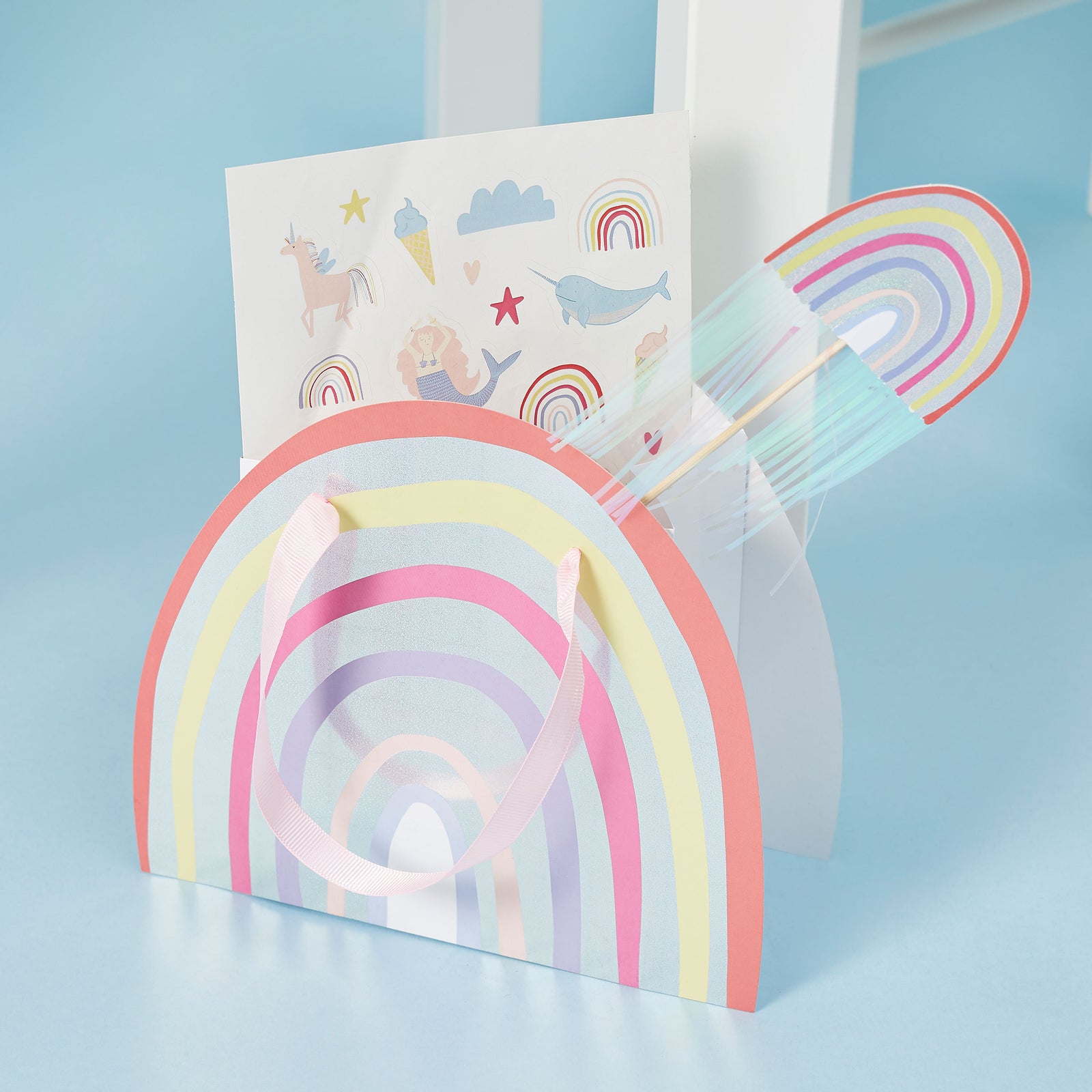 Rainbow party bag and rainbow wand.