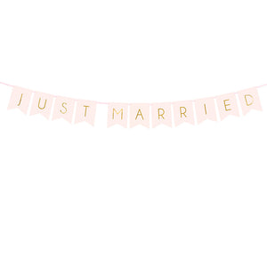 Pink and gold wedding banner with the words written just married