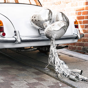 Wedding day silver car decoration kit with three heart balloons, silver tassels and silver cans to decorate the back of the car