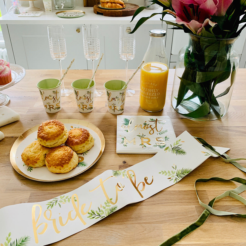 Bride to be white sash and gold foil writing with botanical green motif and green velvet ribbon 