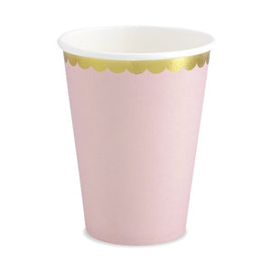 Pale pink paper party cups with gold scalloped edge detail.