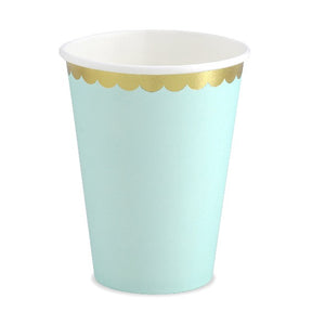 Mint green paper party cups with scalloped gold foil detail.