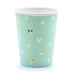 green paper cups with gold and white detail.