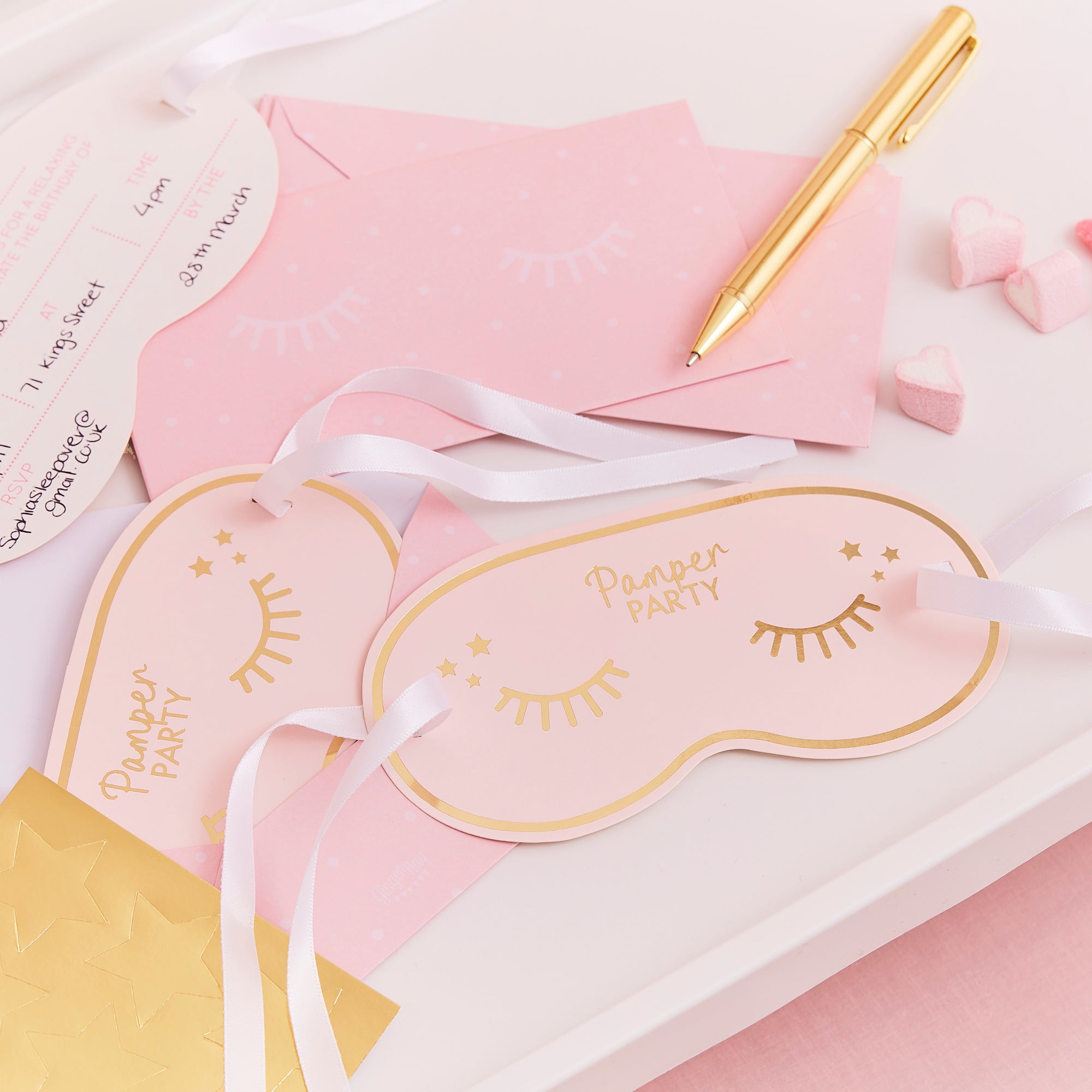 Pink pamper party with gold eyelash design invitations 